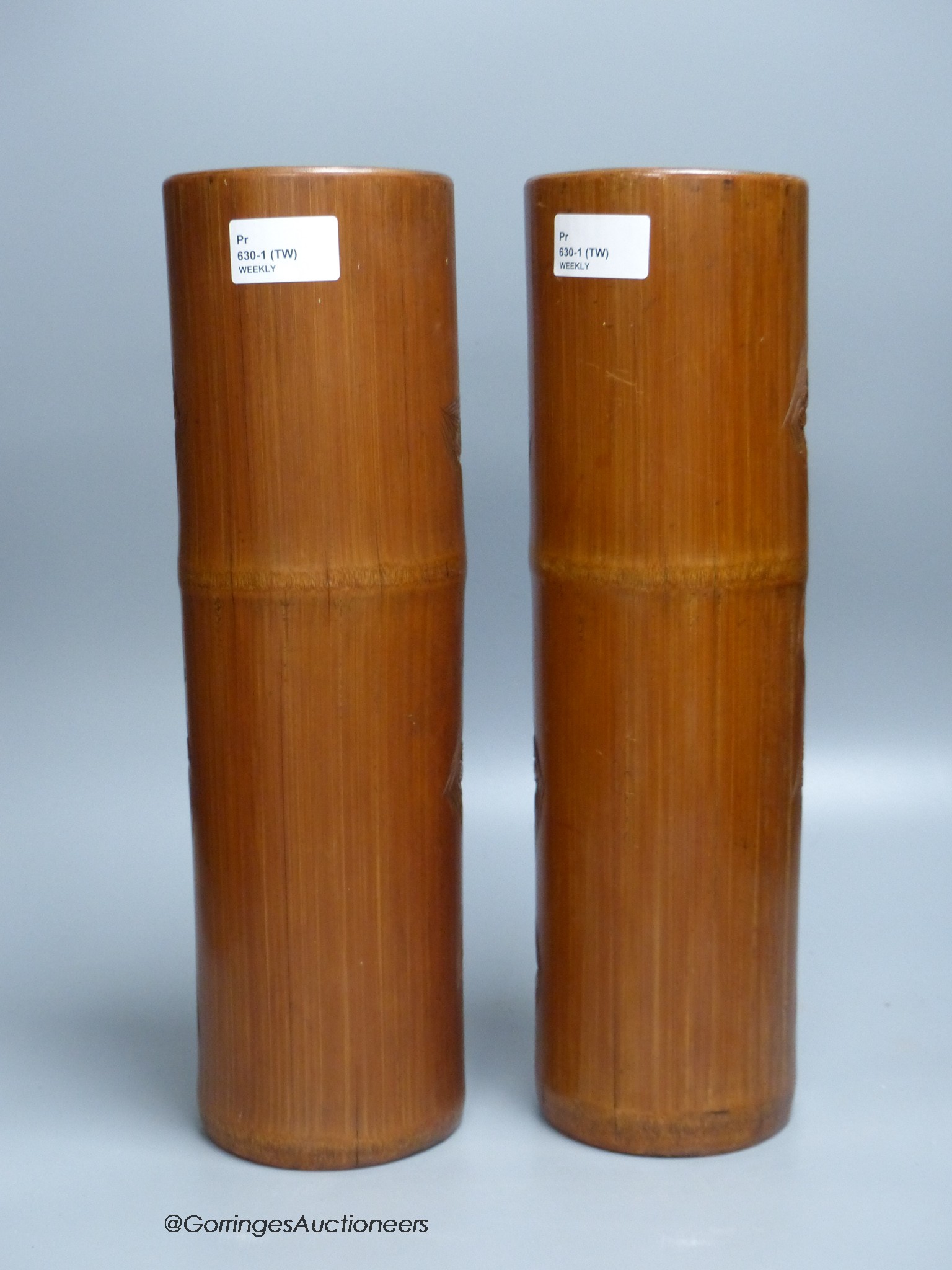 A pair of Chinese bamboo brush pots, carved with scholars in gardens, height 36cm